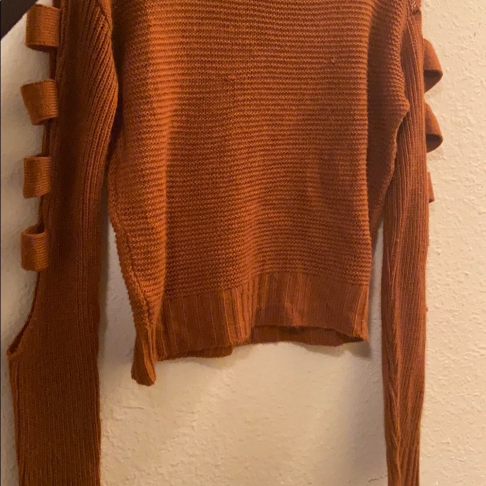 Orange sweater top.